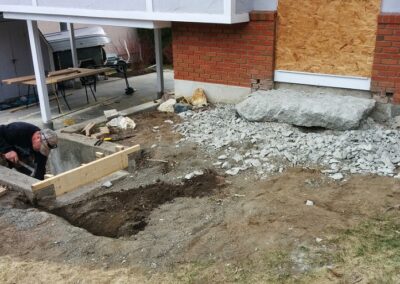 Clearing space for new concrete sidewalk and stairs