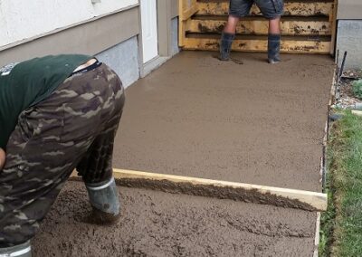 Finishing concrete sidewalk and stairs