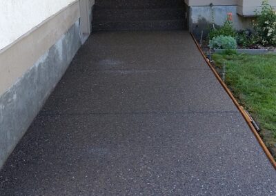 Exposed aggregate concrete sidewalk and stairs