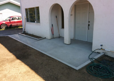 Concrete sidewalk to front doors