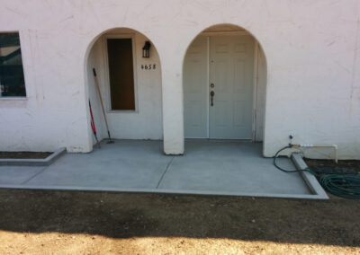 Concrete sidewalk to front doors