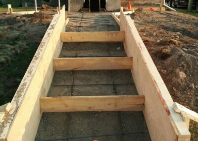 Forms laid for new concrete sidewalk and stairs