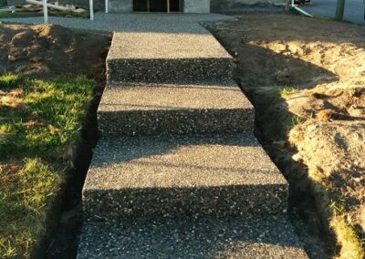 Exposed aggregate concrete sidewalk and stairs