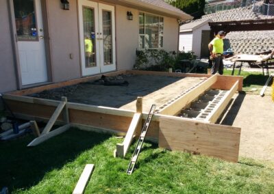 Preparing to pour concrete for a raised patio and sidewalk