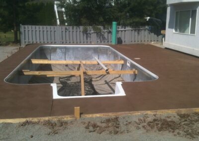 New concrete pool deck using brown concrete