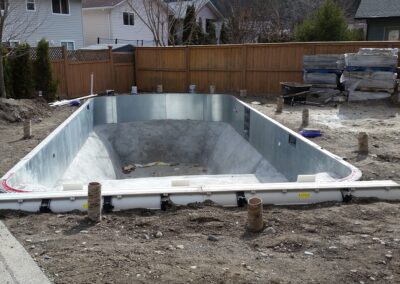 Area around a pool prepared for concrete to be poured