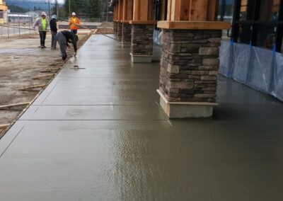 Concrete slab sidewalk next to commercial building